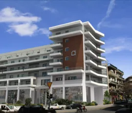 A landmark residential project in Neos Kosmos. Strategic architectural visualization by VARC Studio, integrated into the urban fabric of Athens since 2008. High-fidelity 3D rendering of a corner residential building at Kasomouli 73, Athens, created by VARC Studio.