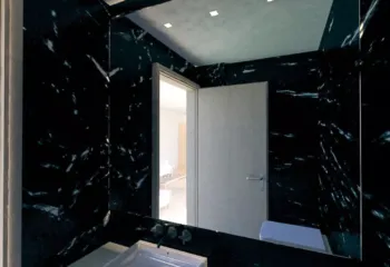 Detailed interior visualization of a luxury black marble WC by Varc Studio.