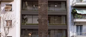 Architectural innovation on Acharnon Street – The Acharnon 60 Residential Project. Modern residential building at Acharnon 60, Athens, featuring a distinctive brown perforated vertical screen and contemporary facade design, visualized by VARC Studio.