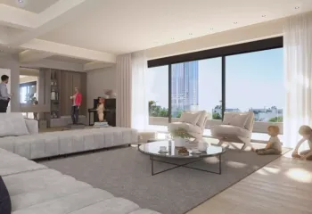 Spacious luxury living room in Elliniko by VARC Studio featuring large floor-to-ceiling windows with a direct view of the Riviera Tower minimalist furniture and natural lighting