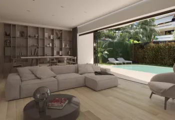 Private oasis in the heart of Alimos. Project: Ikarou 7 | Developer: Thekla Constructions. Modern ground floor maisonette living room in Alimos with beige sofa wooden bookshelves and large sliding glass doors opening to a private garden with swimming pool by Thekla Constructions