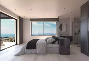 Waking up to the blue horizon. Project: Ikarou 7 | Developer: Thekla Constructions. Luxury master bedroom in Alimos with a dark marble open en-suite bathroom minimalist furniture and a private balcony overlooking the Saronic Gulf by Thekla Constructions