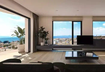 Breathtaking vistas of the Saronic Gulf. Project: Ikarou 7 | Developer: Thekla Constructions (2025). High-end penthouse living room in Alimos with a modern ethanol fireplace large balcony with sea view and minimalist furniture by Thekla Constructions