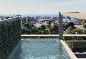 Rooftop infinity swimming pool in Elliniko by VARC Studio featuring a lush vertical garden wall and a panoramic view of the Saronic Gulf and the coastal skyline