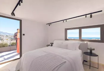 High-end loft bedroom rendering with natural light and sea breeze feel, Athens Riviera