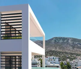 Elevated luxury living in Ano Glyfada | Project Amerikis 2 by PSI Constructions. Close-up exterior 3D architectural rendering of a luxury penthouse in Ano Glyfada, featuring a modern terrace with infinity glass details and mountain views.