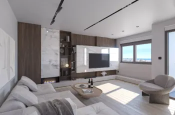 The sophisticated living area of Palaio Faliro Loft featuring a bespoke marble-clad fireplace, integrated media wall, and designer furniture, all bathed in natural Greek light. Modern living room with marble fireplace wall and custom wooden cabinetry in Palaio Faliro Loft