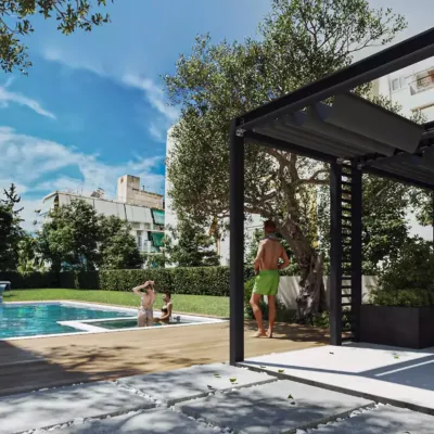 Communal garden and wellness amenities at Tyrinthou 3, Palaio Faliro. Exterior 3D rendering of the communal garden at Tyrinthou 3 in Palaio Faliro, featuring a swimming pool, gym facilities, and modern landscaping.