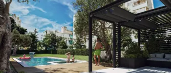 Exterior 3D rendering of the communal garden at Tyrinthou 3 in Palaio Faliro, featuring a swimming pool, gym facilities, and modern landscaping.