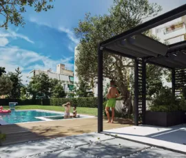 Communal garden and wellness amenities at Tyrinthou 3, Palaio Faliro. Exterior 3D rendering of the communal garden at Tyrinthou 3 in Palaio Faliro, featuring a swimming pool, gym facilities, and modern landscaping.