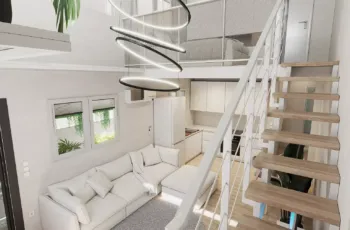 Elegant two-level living space featuring high ceilings, a minimalist wooden staircase, and abundant natural light. Modern loft apartment interior with wooden staircase and designer lighting in Agios Dimitrios