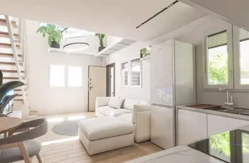Open plan modern apartment layout with living room, dining area and staircase in Agios Dimitrios