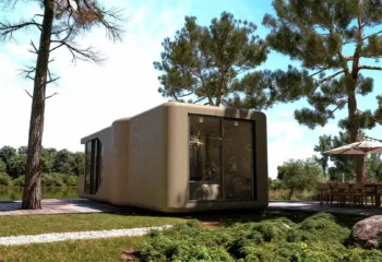 Exterior 3D architectural rendering of a modular capsule home in daylight, showcasing a large glass wall bedroom facade and a paved stone pathway on the lawn.