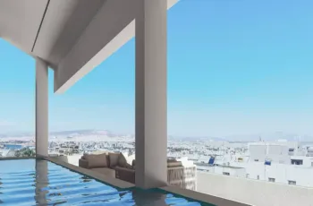 Architectural elegance meets luxury living at the PLEIADON terrace, featuring a private pool with endless views over Palaio Faliro. Modern terrace with private pool and panoramic city views at PLEIADON project in Palaio Faliro by VARC Studio.