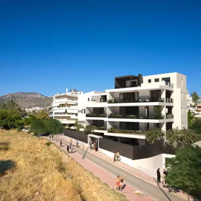 Focusing on the architectural details, our 3D Rendering Services in Athens highlight the clean lines and modern aesthetic of this Glyfada residence. This view from Kritis street emphasizes the building's integration with the surrounding urban landscape. Photorealistic exterior 3D Rendering Services in Athens for a luxury residential project in Glyfada, Kritis street.