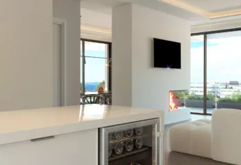 Detail-oriented interior visualization of a luxury kitchen in Glyfada, Kritis street. Close-up of a modern kitchen island with a wine cooler, featuring high-end 3D Rendering Services in Athens for a project in Glyfada.