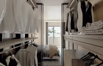 Interior architectural detail of the Papandreou Famar loft in Alimos, highlighting the custom walk-in closet design, rendered by Varc Studio.